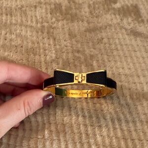 Kate Spade Black and Gold Bow Hinged Bangle Bracelet